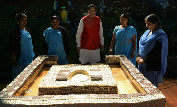 NGO workers make a 250 kg cake in the shape of toilet on World Toilet Day - AFP/File photo NGO workers make a 250 kg cake in the shape of toilet on World Toilet Day - AFP/File photo